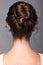 Head and shoulders of a young woman from the back side. Female h