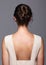 Head and shoulders of a young woman from the back side. Female h