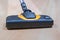 Head of Vacuum Cleaner sweeping laminate floor