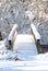 Head on view of a bridge over a stream following a heavy snow in