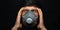 Headache concept. Close-up studio, dramatic portrait of young man holding hands on temple, wearing protective flu mask on black.