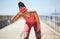 Headache, fever and black woman runner by the sea with fitness, training and running injury. Head pain, sports and