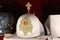 Headdresses of priests on a red background