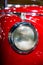 Headlamp from old fashioned, red sports car