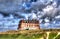 The Headland hotel Newquay Cornwall UK from Fistral beach in bright colourful HDR with cloudscape