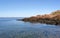 Headland with pink granite and blue sea