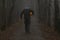 Headless man with Halloween pumpkin in foggy forest