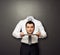 Headless man holding head on white plate