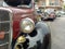 Headlight and bumper of old antique 1935 Ford V8 coupe parked in