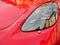 Headlight red sports luxury car closeup