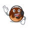 With headphone chocolate donut mascot cartoon