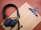 Headphone on the wooden clipboard.