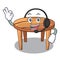 With headphone wooden table isolated on the mascot