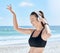 Headphones, beach and woman dance after workout, training or exercise. Freedom, energy and happy fitness female