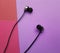 Headphones on a colored violet background musical