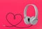 Headphones with hearth shaped cable on pink