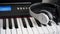 Headphones on musical synthesizer keyboard. Headphones on electronic piano