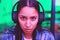 Headphones, portrait or gaming woman in neon home with focus, strategy or serious face expression for esports. Zoom