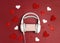 Headphones with romantic gift box and hearts on red background. St. Valentines Day music gift concept