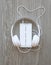 Headphones and smartphone with word `Your text here` on white screen
