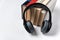 Headphones and a stack of books on white background. Audio library audio books concept