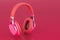 Headphones in trending viva magenta colors, 3D rendering