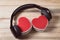 Headphones and two gift boxes in the shape of a heart. Music of hearts. Top view