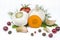 Heads of garlic, carrots and tomatoes, allspice and cranberries isolated on a white background