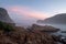 The Heads, Knsyna, Garden Route, South Africa. Rocky outcrop at the top of the lagoon, photographed in mist at sunset.