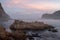 The Heads, Knsyna, Garden Route, South Africa. Rocky outcrop at the top of the lagoon, photographed in mist at sunset.