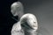 Heads of two mannequins on a black background