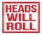 HEADS WILL ROLL, text on red grungy stamp sign