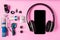 The Headset listen music with mobile phone and Accessory set technology Blank space on bright pink background