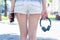 Headset without wire concept. Rear back behind cropped close up view photo of jeans denim mini shorts slim slender fit legs hips