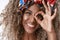 Headshot attractive, carefree young african-american hipster woman, blond with afro hairstyle, wear stylish headband