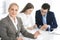 Headshot of business woman at negotiation. Group of business people discussing questions at meeting in modern office