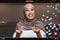 Headshot of cheerful adult arab lady in hijab, shooting video blog or teaches remote online