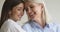 Headshot closeup happy two generations businesswomen looking at camera.