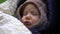 Headshot of cute sleeping charming Caucasian little child outdoors. Close-up portrait of adorable cute toddler girl with