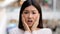 Headshot female emotional face asian ethnic korean girl 20s woman model frightened lady scared fear horror disgust