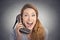 Headshot happy woman looking excited holding high heeled shoe as phone