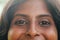 Headshot of happy young Indian woman with nice hair