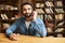 Headshot of indian male support worker wearing wireless headset