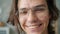 Headshot of joyful young man at home looking at camera and smiling indoors