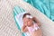 Headshot of a Newborn Baby Girl Sleeping on a Surfboard