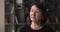 Headshot portrait dreamy elderly woman standing indoor looking into distance