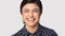 Headshot portrait of happy indian girl posing on grey background