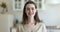 Headshot portrait of happy young woman pose in kitchen