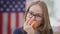 Headshot portrait of positive pretty schoolgirl eating vitamin apple looking at camera smiling. Smart confident happy