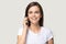 Headshot portrait positive woman talking on phone isolated on grey